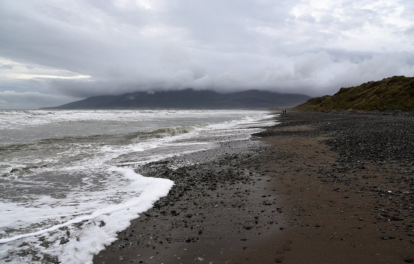 The wide sandy beach and dunes at Murlough, County Down, a Special Area of Conservation, with the Mourne Mountains beyond.